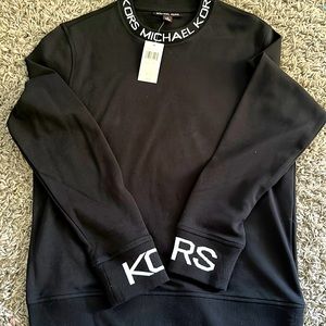 Cleaning out my closet need gone asap!! Long sleeve MK sweater. Worn once.